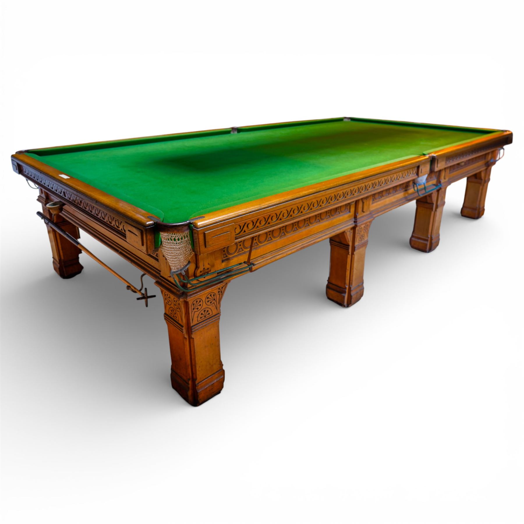 An outstanding bespoke late Victorian Aesthetic Movement golden oak full-sized snooker table of gothic influence, the rectangular slate bed covered in green baize within moulded rails and rounded pocket mounts, the protruding frame decorated with blind-fretwork frieze panels of Vitruvian scrolls and geometric ornament, over rails of repeating roundel carvings, raised on square chamfered and reeded supports with carved detail and panelled reserves, with further stylised brackets, stamped to the underside on all four edges R Anderson, serial number 4337
Viewing in situ near Tadcaster, please contact Chloe to arrange - 01904 393300