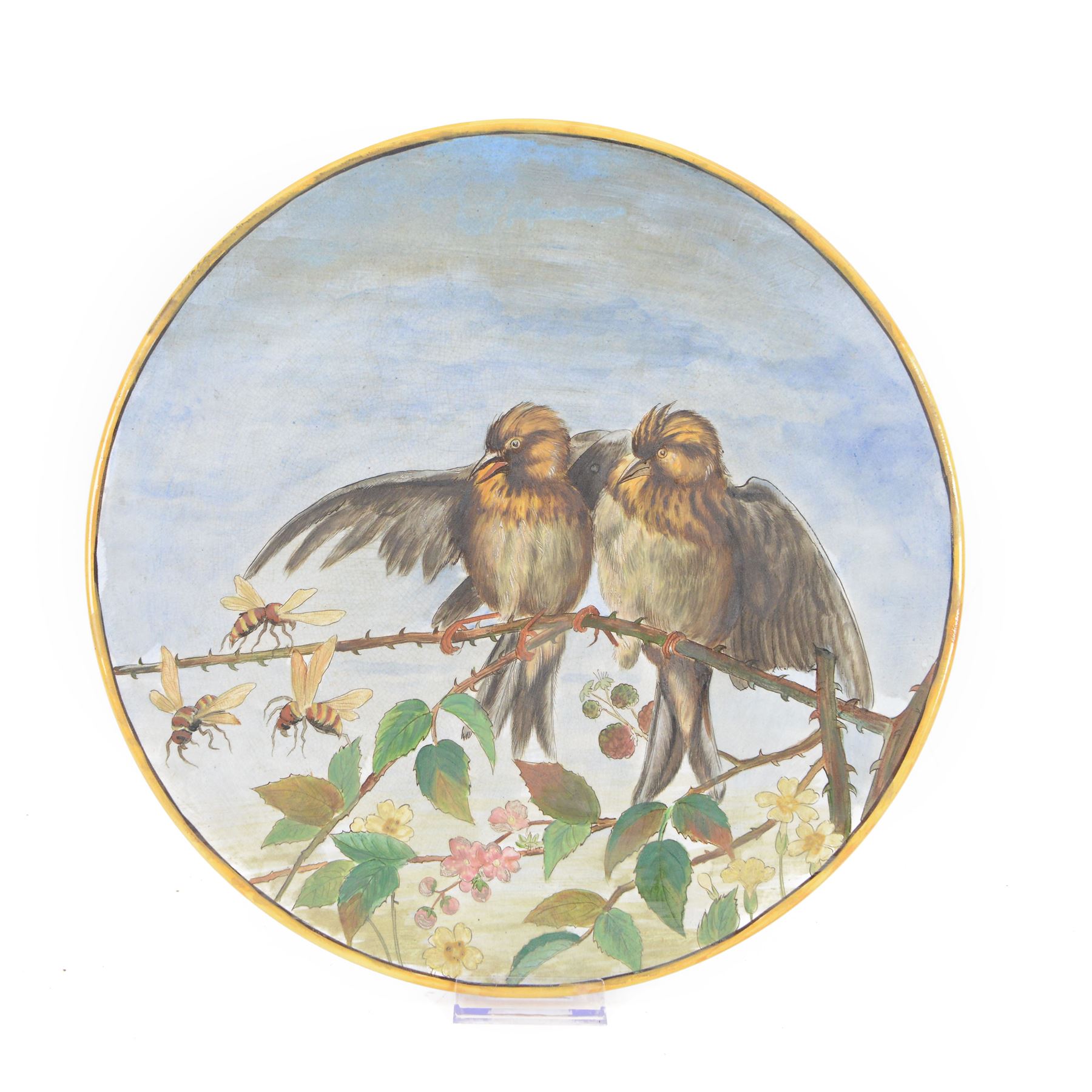 Victorian pottery circular charger, painted with birds upon a rose bush, with painted makers mark to the base Howell and James London, D34cm 