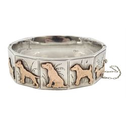 Early - mid 20th century silver dog bangle, five panels with applied rose gold dogs including West Highland Terrier, Labrador and Dachshund, Chester 1940, in velvet and silk lined box