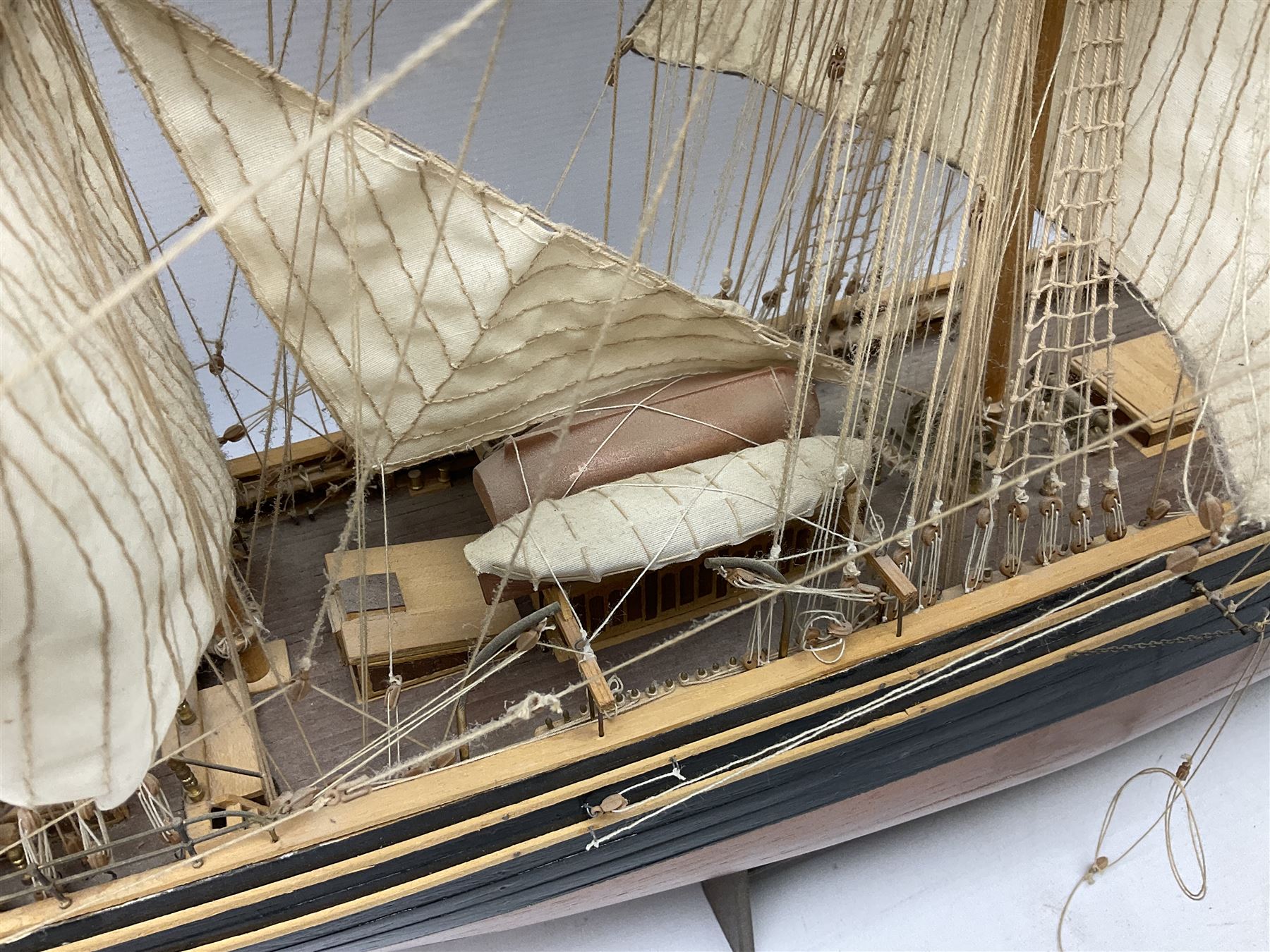 Three masted kit built sailing ship with cloth sales, deck fittings and full rigging, on open display, L110cm, H80cm  