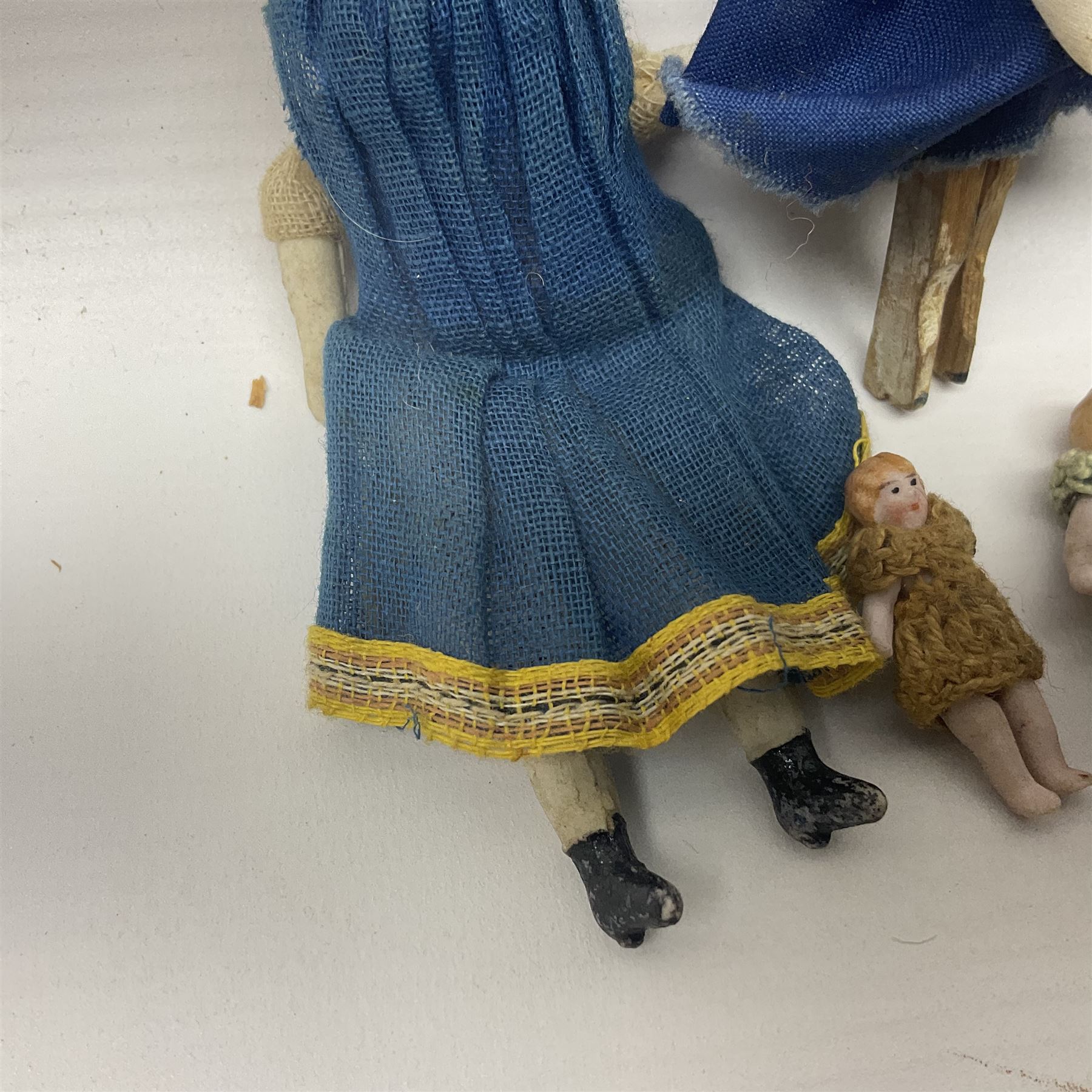 Twelve miniature bisque, bisque headed and wooden dolls to include articulated examples, tallest 12cm 