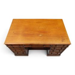Victorian mahogany kneehole desk, rectangular top fitted with central frieze drawer over recessed cupboard, flanked by four graduating drawers to each side, on skirted base