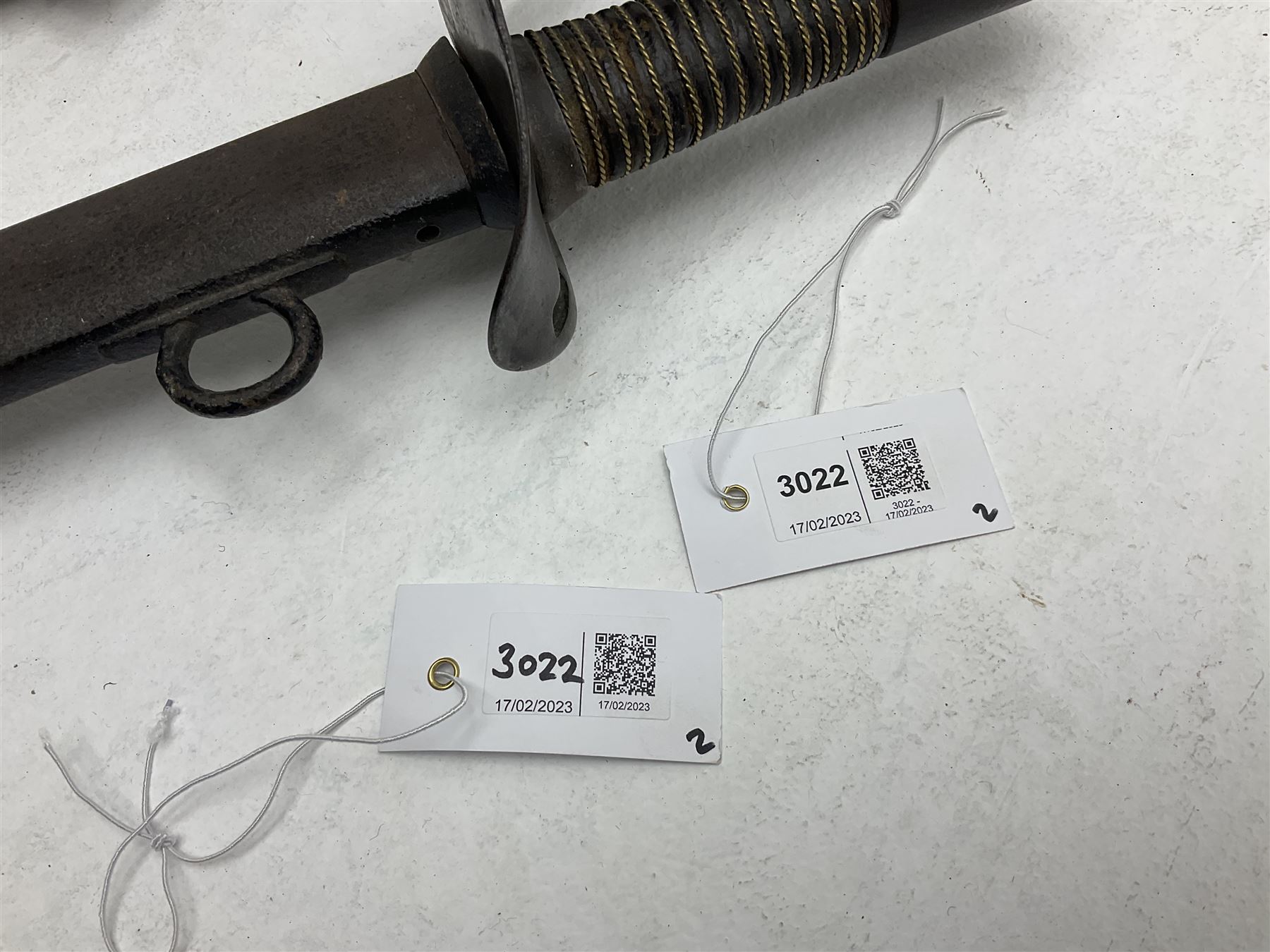 19th century Imperial German army heavy cavalry officers sword by Schnitzler and Kirschbaum, with 89cm single fullered steel blade and sheet steel basket hilt with teardrop cut-out and wire-bound leather grip L107.5cm overall; in steel scabbard with two suspension rings; and British Army 1822 Pattern Infantry Officer's sword in associated scabbard (2)