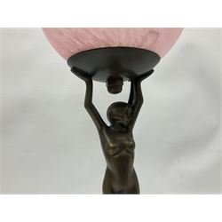 Art Deco style table lamp, modelled as a nude female figure, her arms raised supporting a mottled pink and white shade, together with a spare matching shade, H44cm 