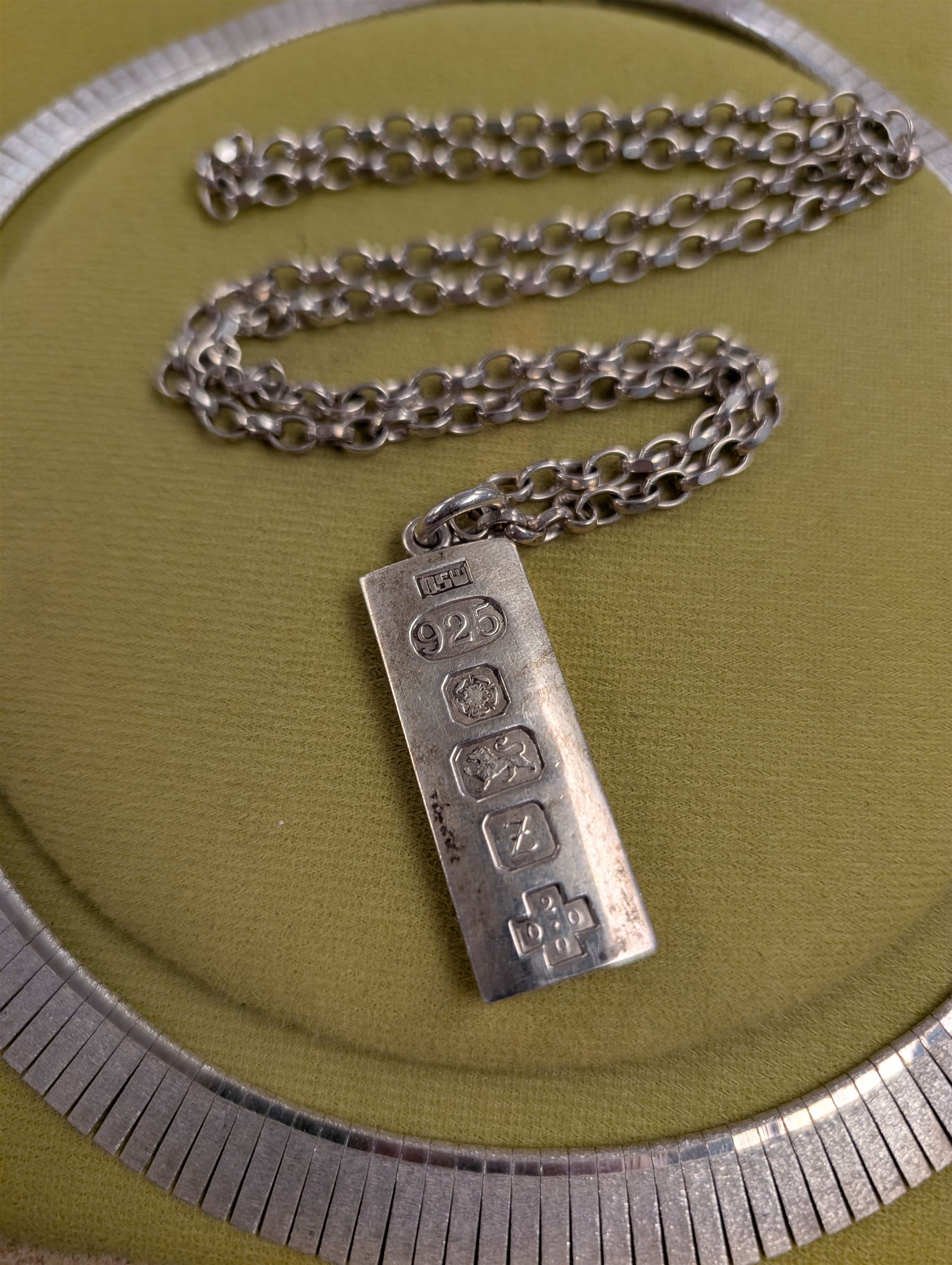 Silver ingot, hallmarked Sheffield 2000, on a silver chain, together with a silver fringe necklace