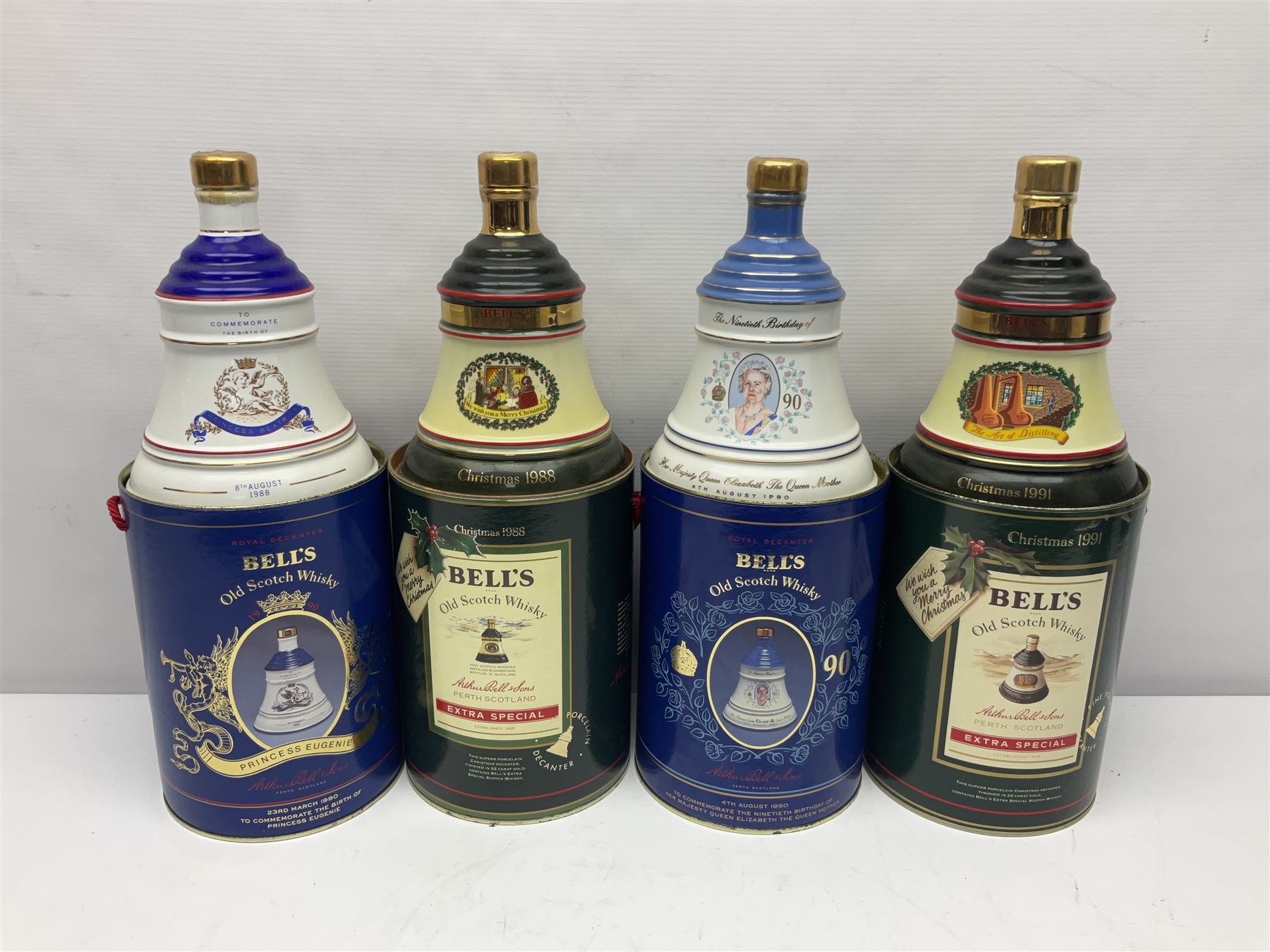 Bells, Scotch whisky, in seven Wade ceramic decanters, including Christmas 1988, 1989, 1990, 1991 etc
