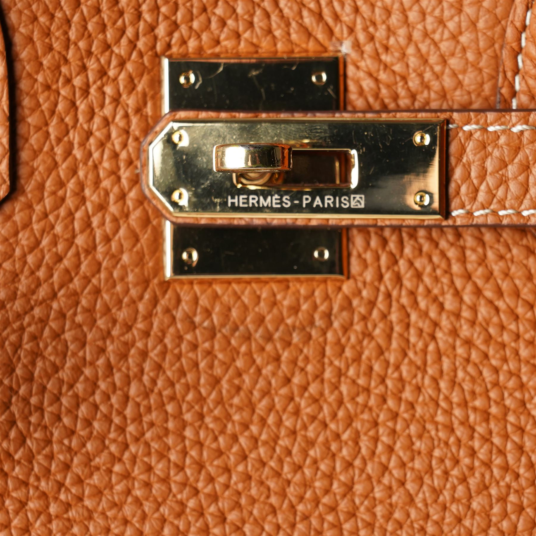 Hermès - gold hardware 'Birkin 35' handbag in gold Togo leather with white stitching, featuring gold-plated hardware, double rolled handles, front flap, belted turn-lock closure, and leather lining with one zip and one slip pocket, stamped 'Hermes Paris Made in France' in gold, with blind-stamp Q (2013) with craftsman’s code 70A to the underside of locking belt. Accompanied by: padlock, keys, clochette, Hermes dust bag, booklet, and ribbon. New unused condition.