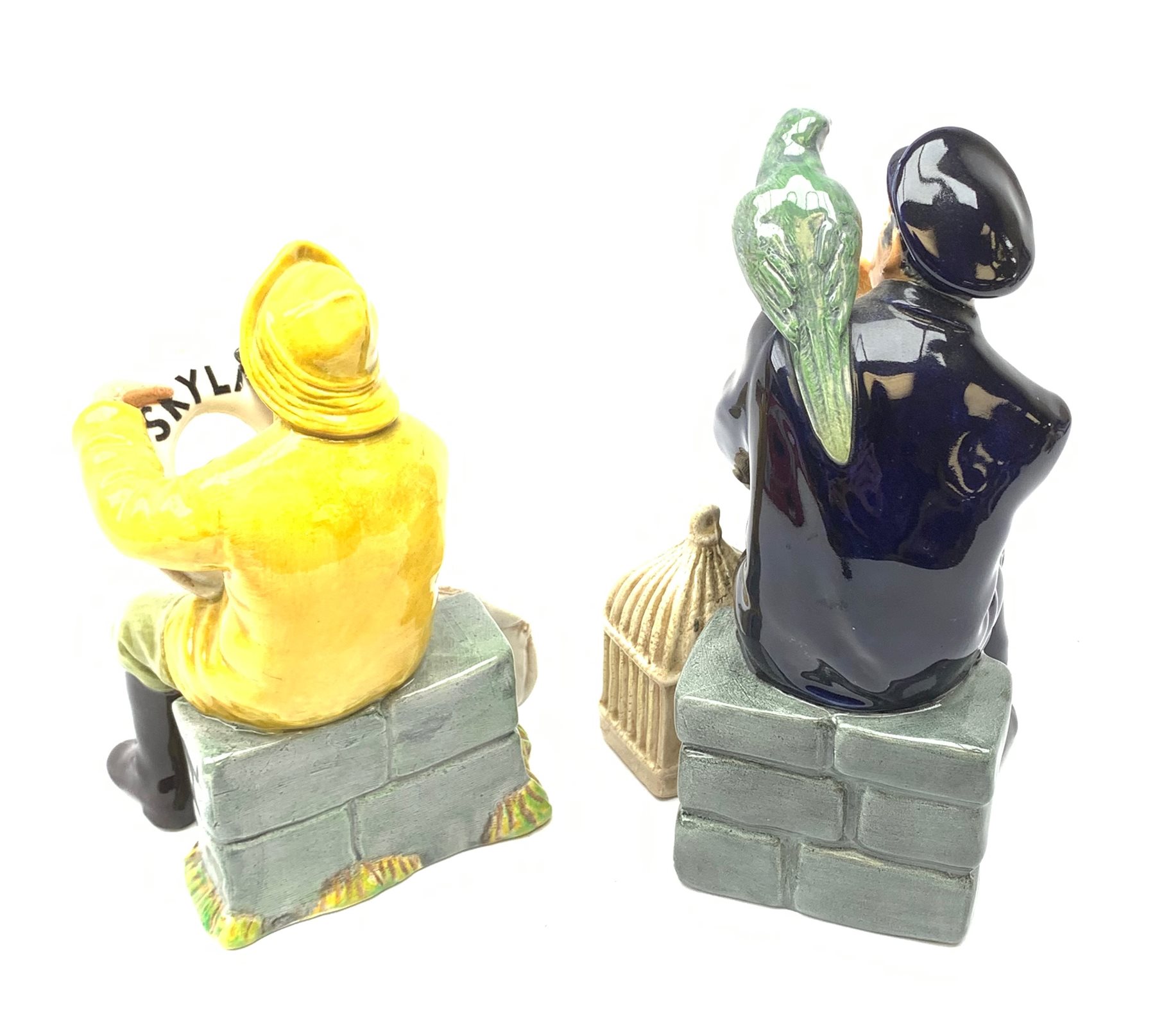 Two Royal Doulton figurines,  The Boatman HN2417, and Shore Leave HN2254, each with green printed mark beneath.