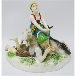  Meissen model of a Goatherd and his lass on a rocky outcrop, blue cross swords mark to base no. V124, L22cm   