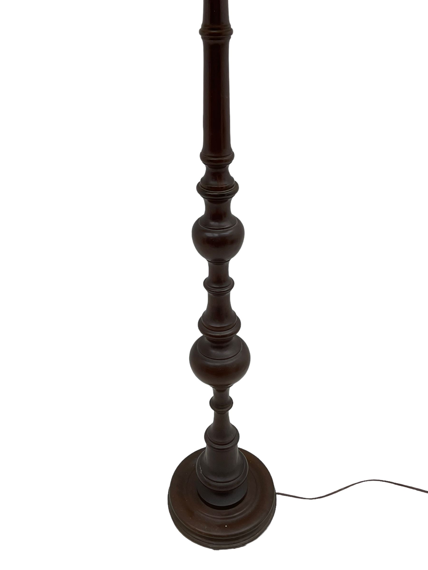 20th century walnut standard lamp, turned column on circular base, with shade 