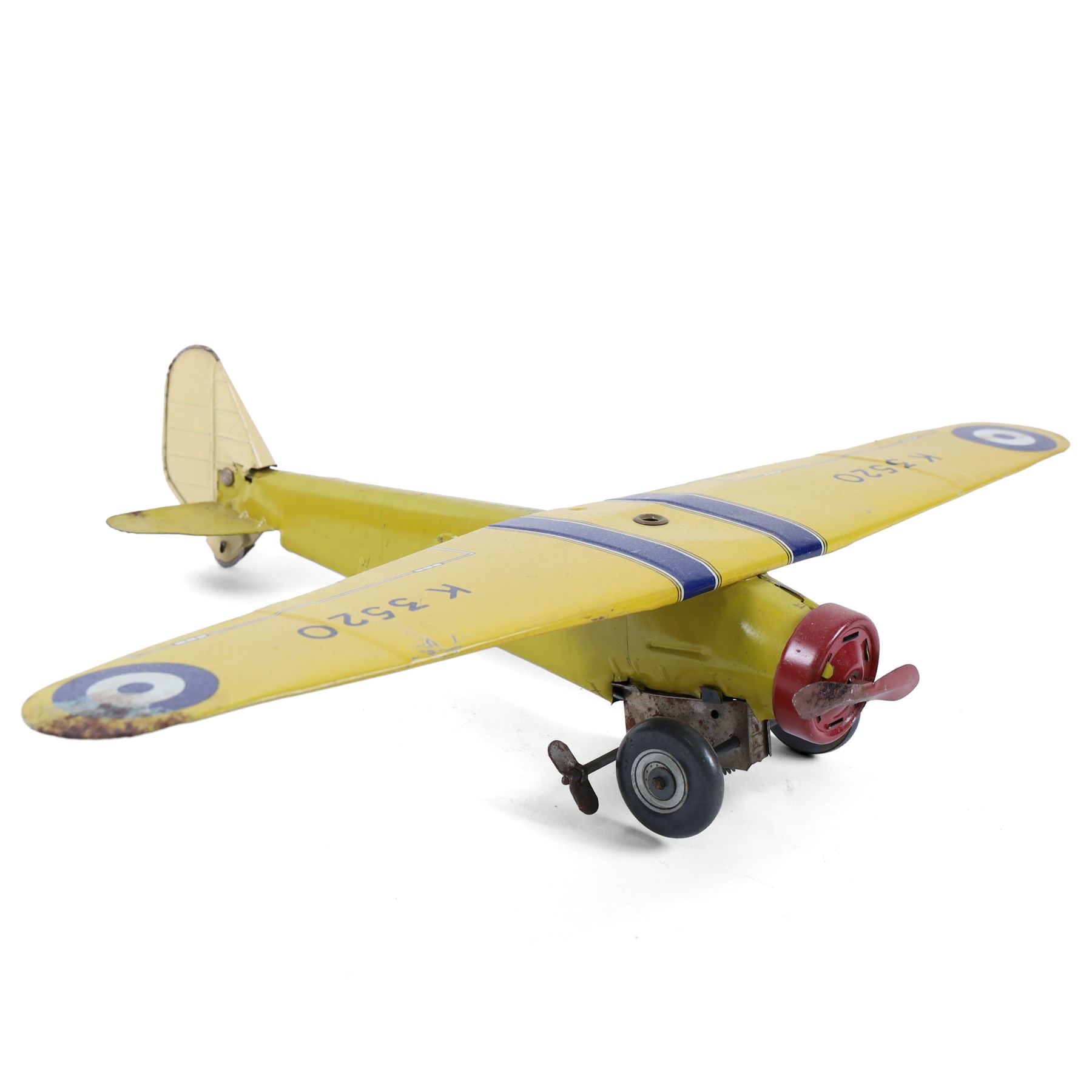 Four tinplate model aeroplanes, comprising Mettoy clockwork single-engined model no. K3520 in yellow with blue stripes and red engine cowl, Mettoy clockwork monoplane with silver and red lithographed body, Wells of London clockwork aeroplane no. 301 in green with lithographed details and a  small German bi-plane in yellow, three clockwork examples with key