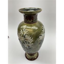 A Doulton Lambeth vase, of ovoid form decorated with white flowers in low relief, between foliate bands, with impressed marks beneath, H31cm. 