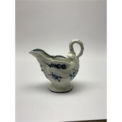 18th century Worcester cream boat, circa 1770, with moulded helmet shaped body and lamprey handle, decorated with floral sprays and sprigs, the interior rim with crows foot border, H8.5cm L9cm 
Cf. Bonhams, ' The Zorensky Collection of Worcester Porcelain, Part 2 ', Lot 313

