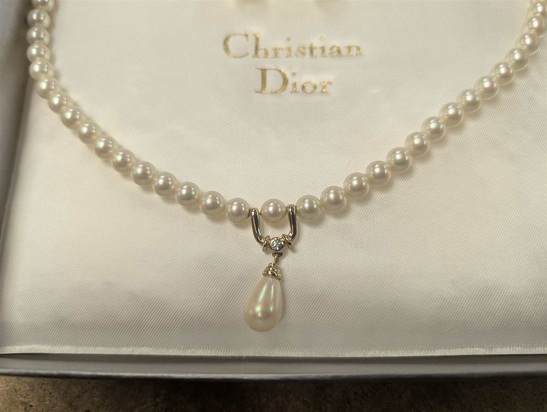 Pair of Christian Dior clip on hoop earrings, stamped Chr.Dior, together with a faux pearl necklace and similar clip on earrings, stamped Grosse, both within Christian Dior boxes