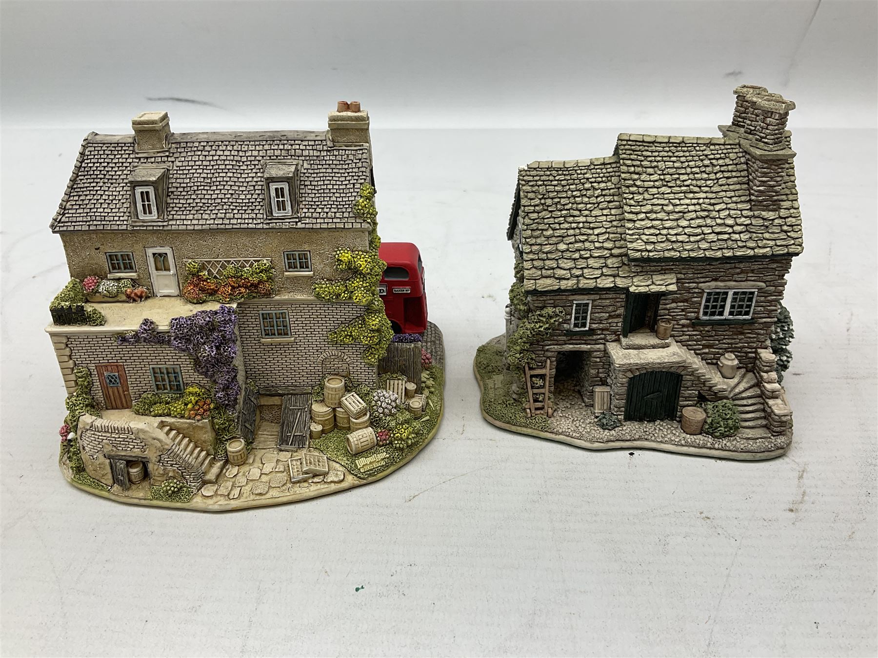 Fourteen Lilliput Lane cottages to include 'Diamond Cottage', 'Kendal Tea House', Visitor's Centre Special 'It's For You' signed to base, The British Collection 'The Sherlock Holmes' etc, all boxed with deeds