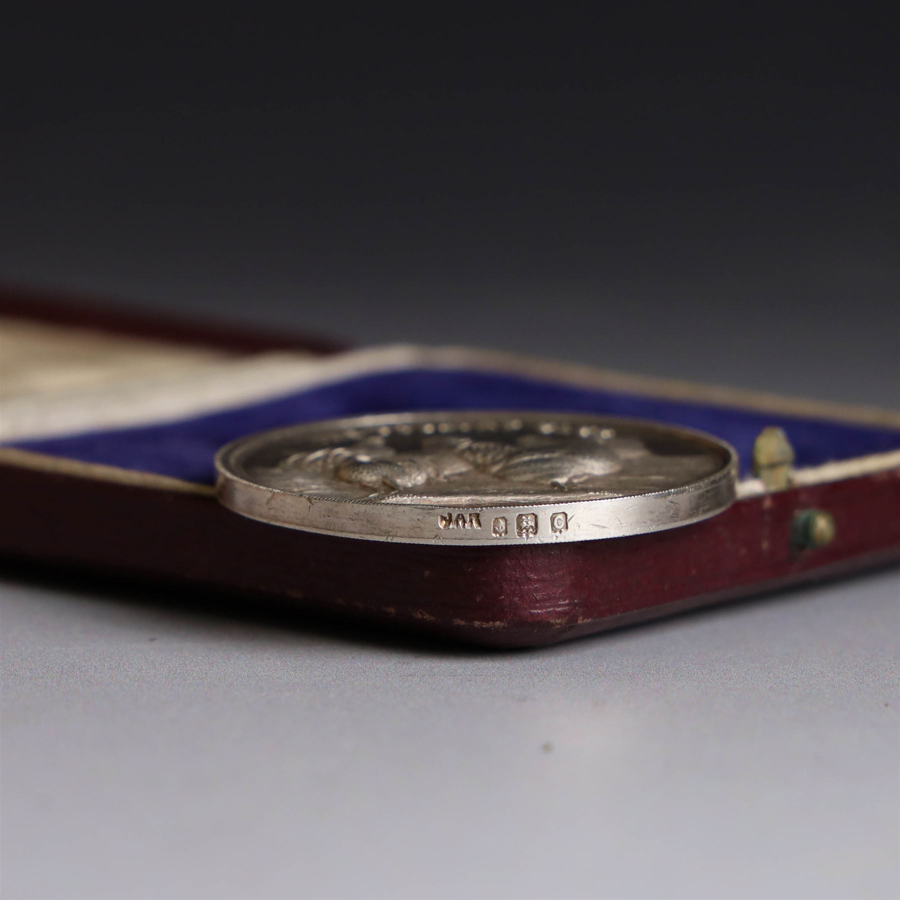 Collection of silver medals, mainly with an agricultural theme, including Poultry Club, Heywood Bicycle Club, heart shaped fob, four within leather cases 