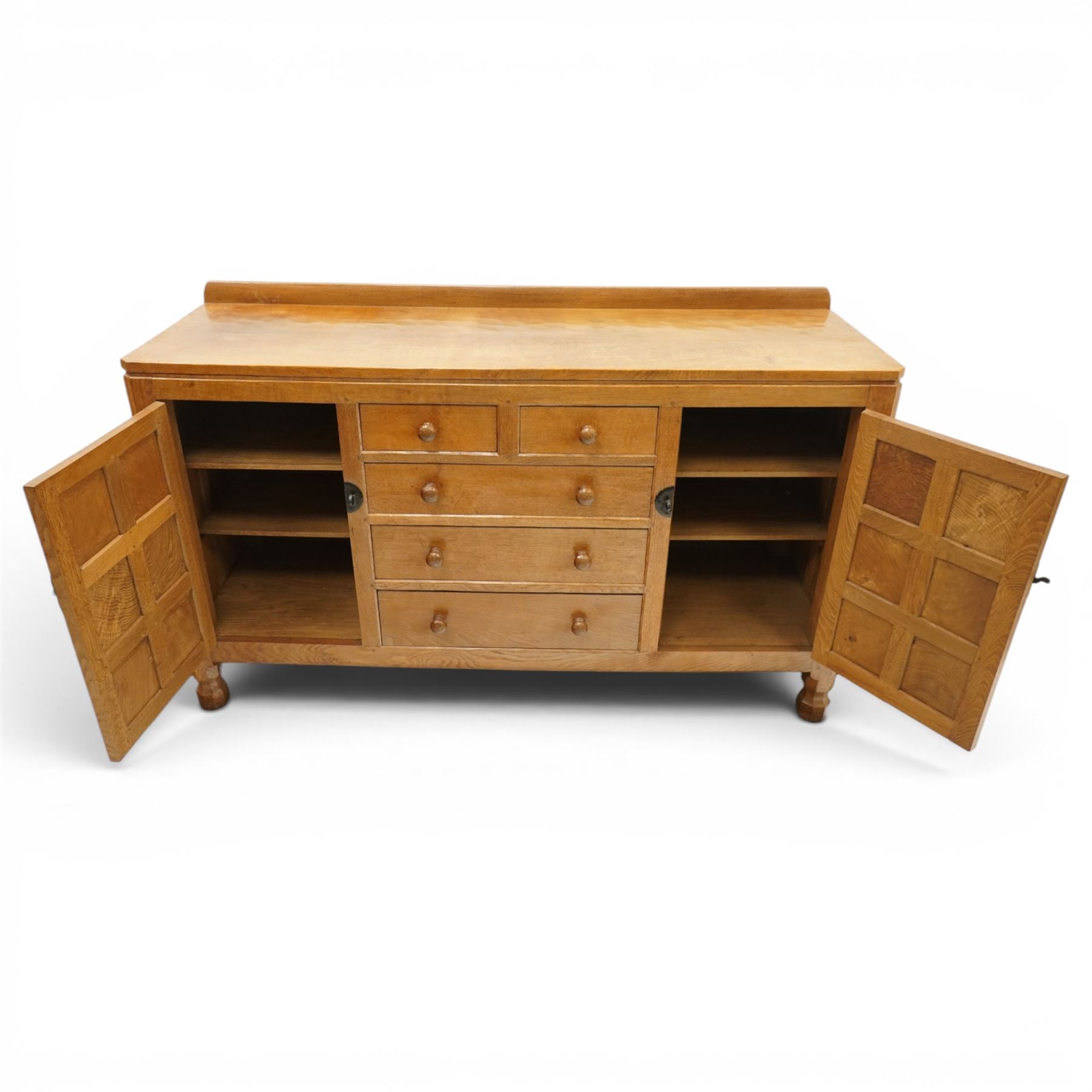 Mouseman - adzed oak dresser, rectangular top with galleried back, fitted with six drawers and two cupboards, blackened metal latches and circular hinges, with carved mouse signature, by the workshop of Robert Thompson of Kilburn
