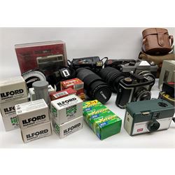 Vintage and later cameras, lenses, accessories and darkroom equipment including Zenit 12XP camera, Praktica BX20 camera fitted with 'Sigma Zoom Master 1:3.5-4.5 f=35-70mm' lens, Praktica LLC camera fitted with 'Carl Zeiss Jena Pancolar 1.8/50' lens, Canon Zoom Lens 'EF 100-300mm 1:5.6', various Jessop and other makers darkroom items including safelight (Red), universal duo tank, multi-mask enlarging easel etc, in three boxes