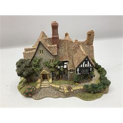 Three Lilliput lanes, comprising Oakwood Smithy, Anne of Cleves and Bluebell Farm, all with deeds and original boxes 