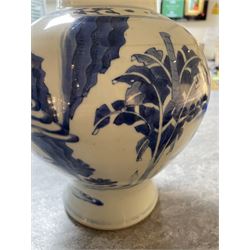 Pair of Chinese Kangxi blue and white porcelain vases, each of baluster form, painted with an outdoor scene containing figures seated upon the ground reading scrolls and holding fans, willow and bamboo tress, rock work and water, H27cm