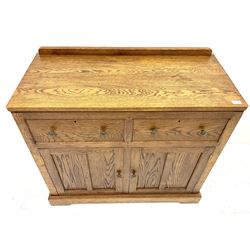 Medium oak sideboard, raised shaped back above two drawers and two cupboards, plinth base