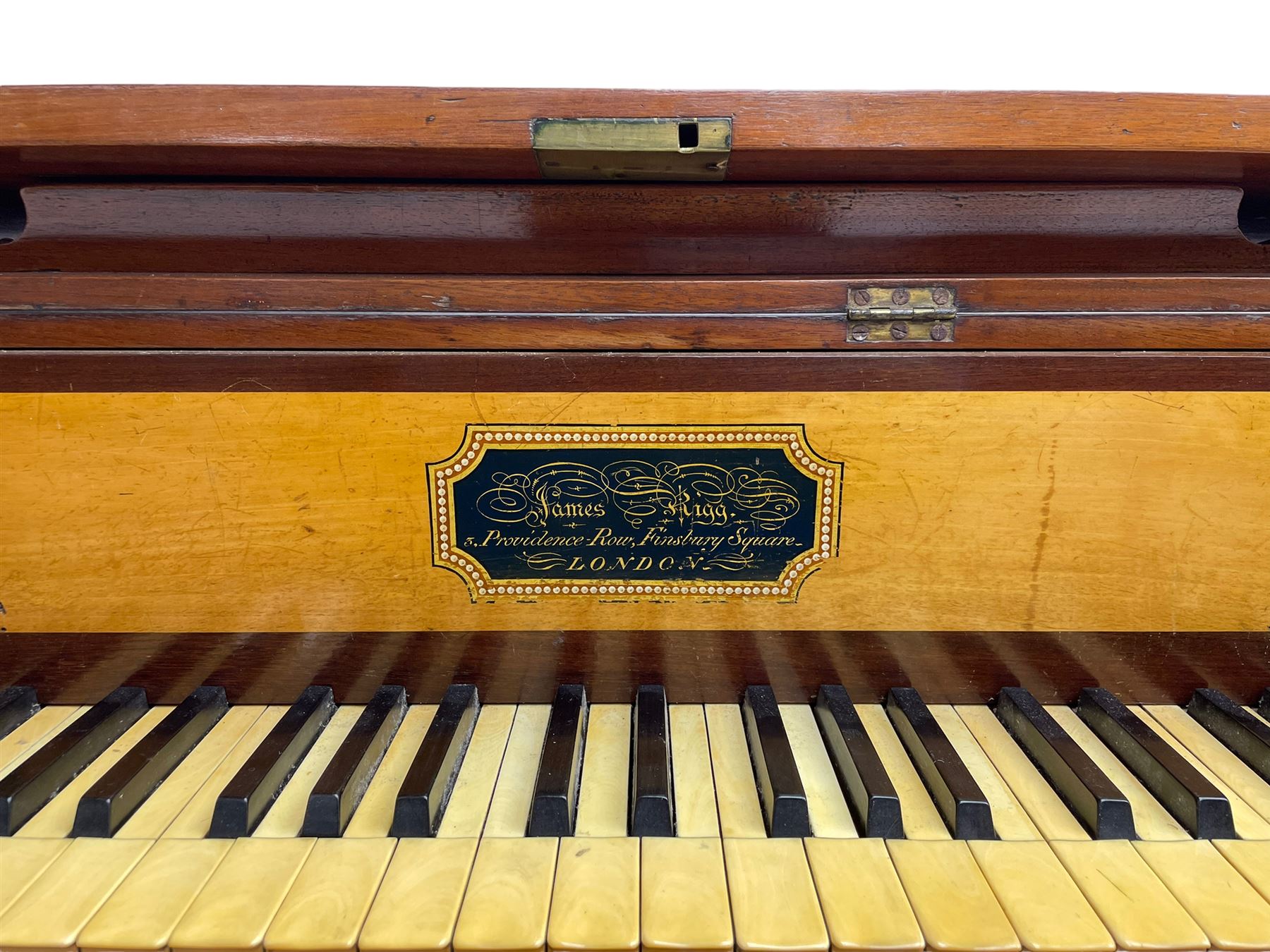 James Rigg, London -early 19th century mahogany and maple square piano c1817, with a 68 key compass (A-C) original hammers, jacks and felt, satinwood interior with ebony and ivory keys, the fretwork interior back inscribed 'James Rigg, 3 Providence Row, Finsbury Square, London', decorated with twist gilt metal edging, fitted with three drawers, on Gillows design turned and reeded supports with brass cups and castors.

This item has been registered for sale under Section 10 of the APHA Ivory Act