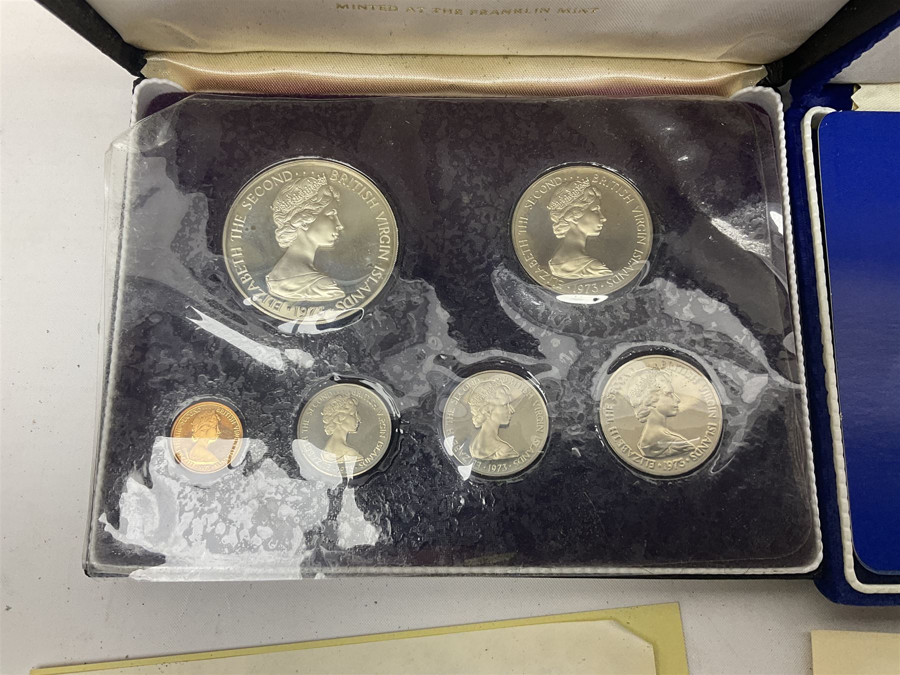 Four British Virgin Islands proof coin sets, comprising First Coinage of the British Virgin Islands 1973 proof six coin set, containing silver one dollar coin, 1977 and 1979 proof sets, containing high denomination silver coins, and The Royal Coronation Jubilee 1977 six coin silver proof set, each minted at the Franklin Mint, all cased with certificates, and a Solomon Islands 1978 proof seven coin set, containing silver five dollar coin, minted at the Franklin Mint, cased with certificate (5)