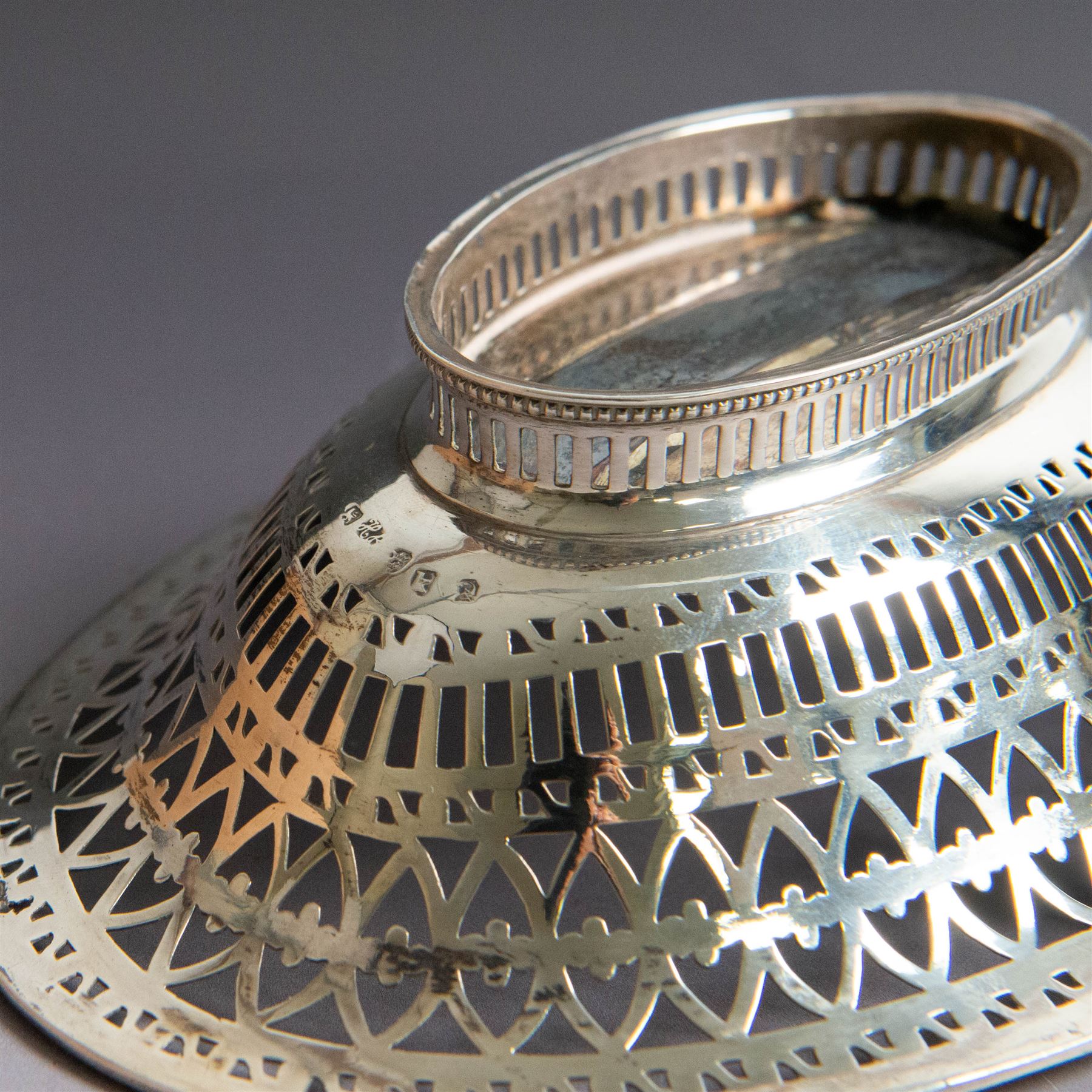 George III silver bon bon basket, of oval form with bead rim and swing handle, the sides with pierced latticework decoration, hallmarked Hester Bateman, London 1785, handle H14cm