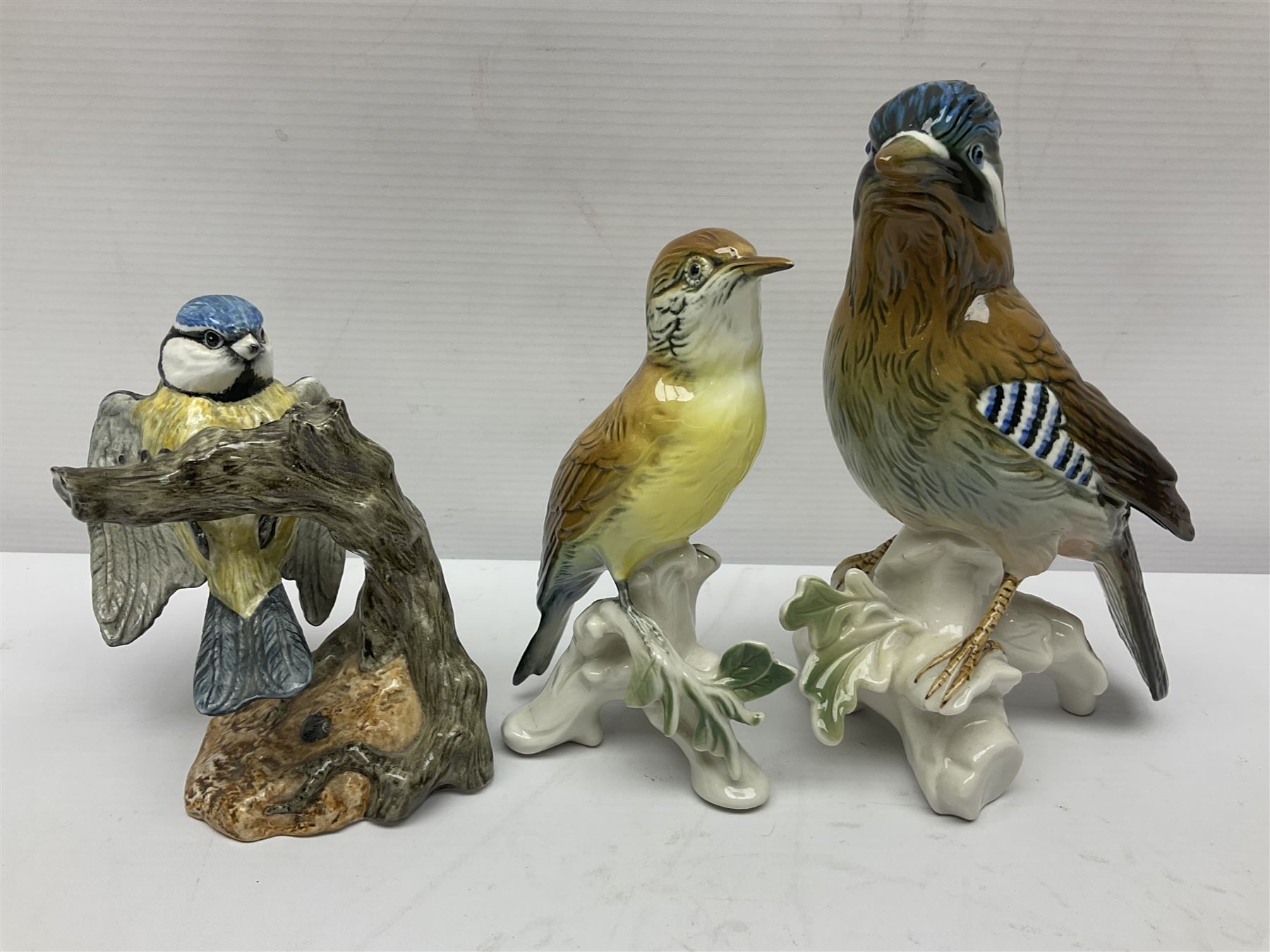 Eight Karl Ens bird figures, together with Mack blue tit and one other