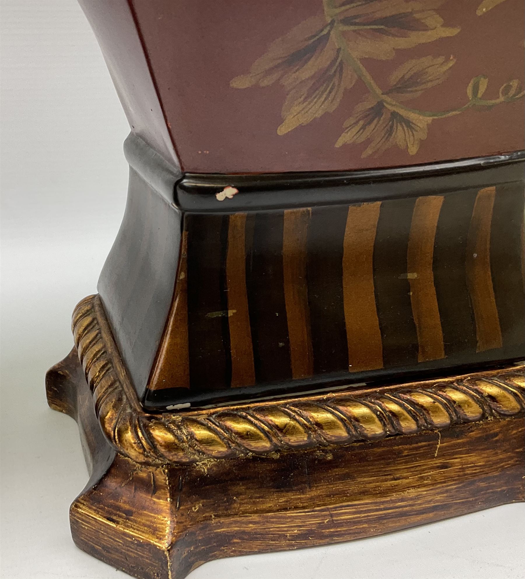 Pair Oriental table lamps decorated with birds in a tree with fruit, on a red ground with a gilded base together with cream lampshades H57cm, without lampshade. 