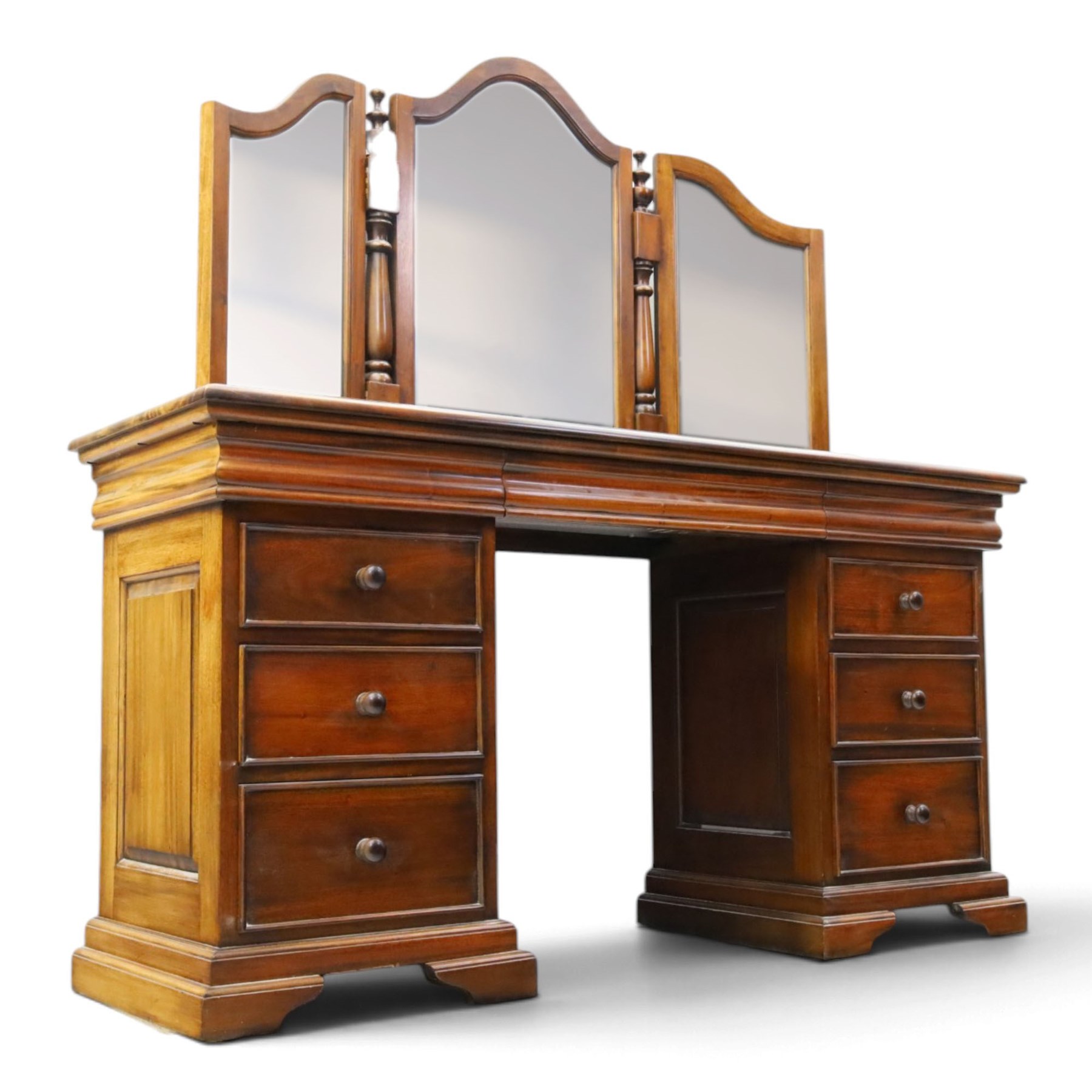 Willis & Gambier - cherrywood dressing table with mirror and stool, three-part mirror on turned uprights with finials, rectangular top above three cushion-moulded frieze drawers, twin pedestals each fitted with three graduated drawers, panelled sides and stepped plinth bases, stool with turned supports and padded seat