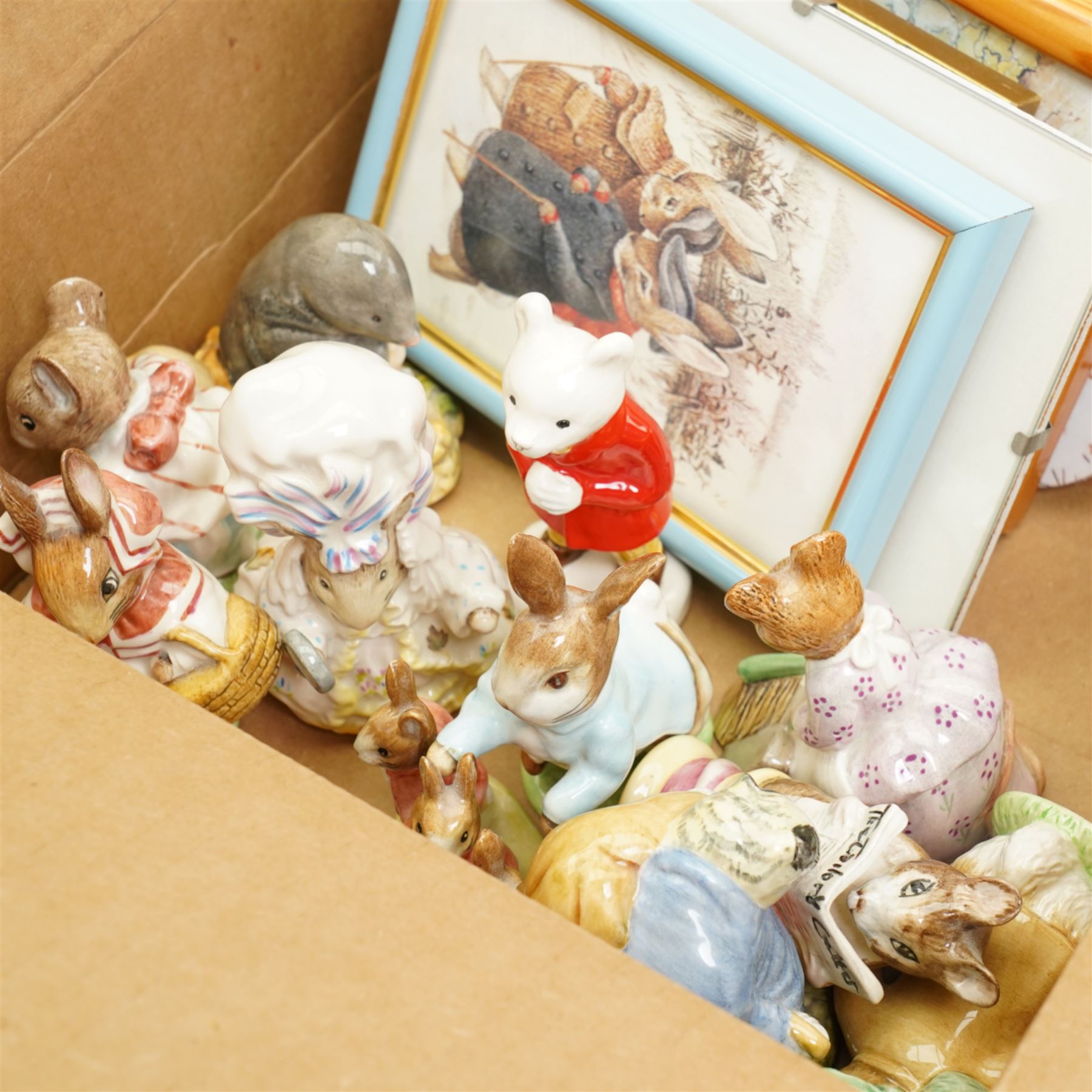Collection of ten Beswick Beatrix Potter figures, brown back stamps, a Rupert figure and a number of Beatrix Potter prints