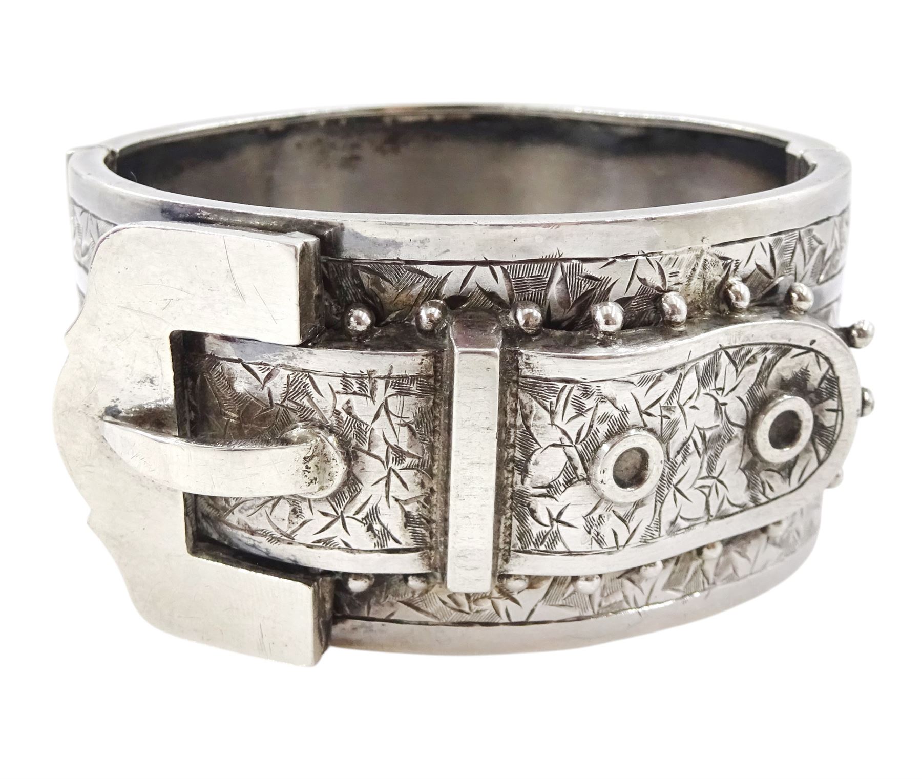 Victorian silver hinged buckle bangle with ivy leaf bright cut decoration by H Bros, Birmingham, 1884