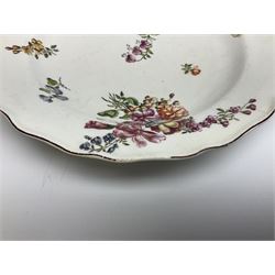 Mid 18th century Chelsea red anchor period plate, circa 1752-1758, of circular form hand painted with floral sprays and sprigs, the wavy edge with iron red rim line, with painted red anchor mark beneath, D21cm