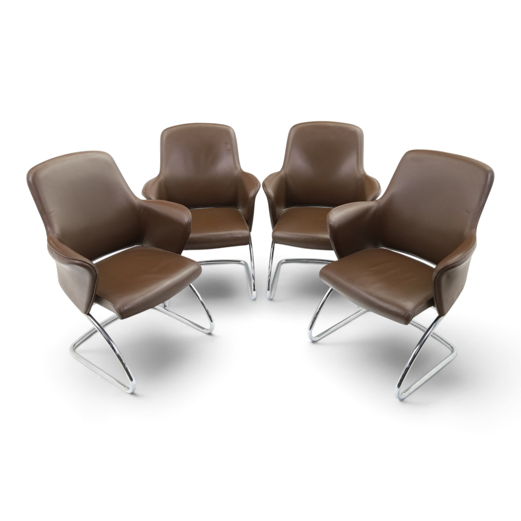 Set of four contemporary Senator executive cantilever chairs, upholstered in Padova hide, moulded back and integrated armrests, raised on a tubular chromed cantilever base