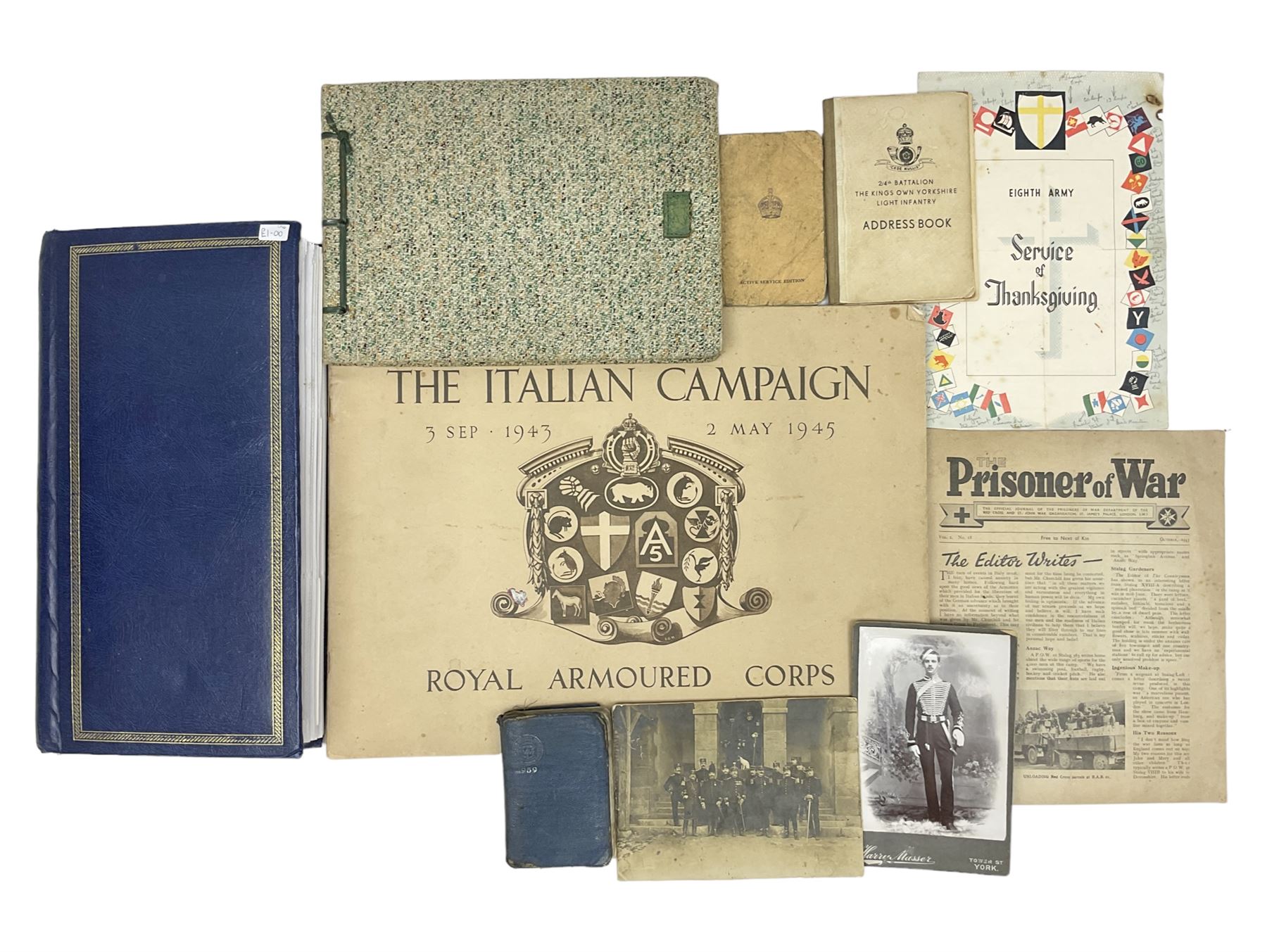 Modern album containing over sixty postcards and photographs including memorial portraits of KIA soldiers, regimental crests, comic, WW1 embroidered silk, uniforms, cap badges, camp and manoeuvre images etc; another personal photograph album of WW2 soldiers relaxing; Royal Armoured Corps booklet 'The Italian Campaign 3rd Sep. 1943 - 2nd May 1945; and other paper ephemera of military interest