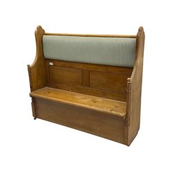 Early 20th century waxed pine pew, inset upholstered striped back panel with hinged box seat enclosing storage, shaped arms and turned supports