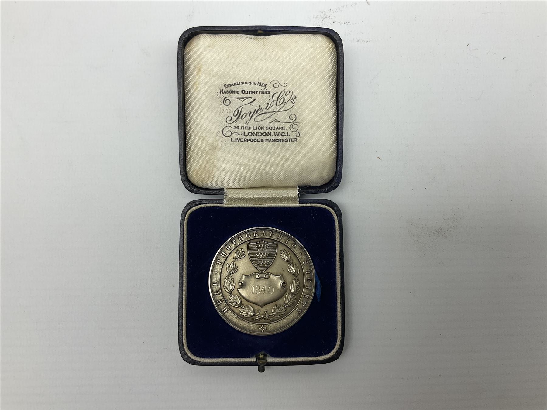 Charles I 1625 hammered silver sixpence, Queen Victoria 1894 crown coin and a cased hallmarked silver medal for the Hull photographic society, engraved '1940' 'Leonard Vokes', all housed in a red Pobjoy Mint coin box