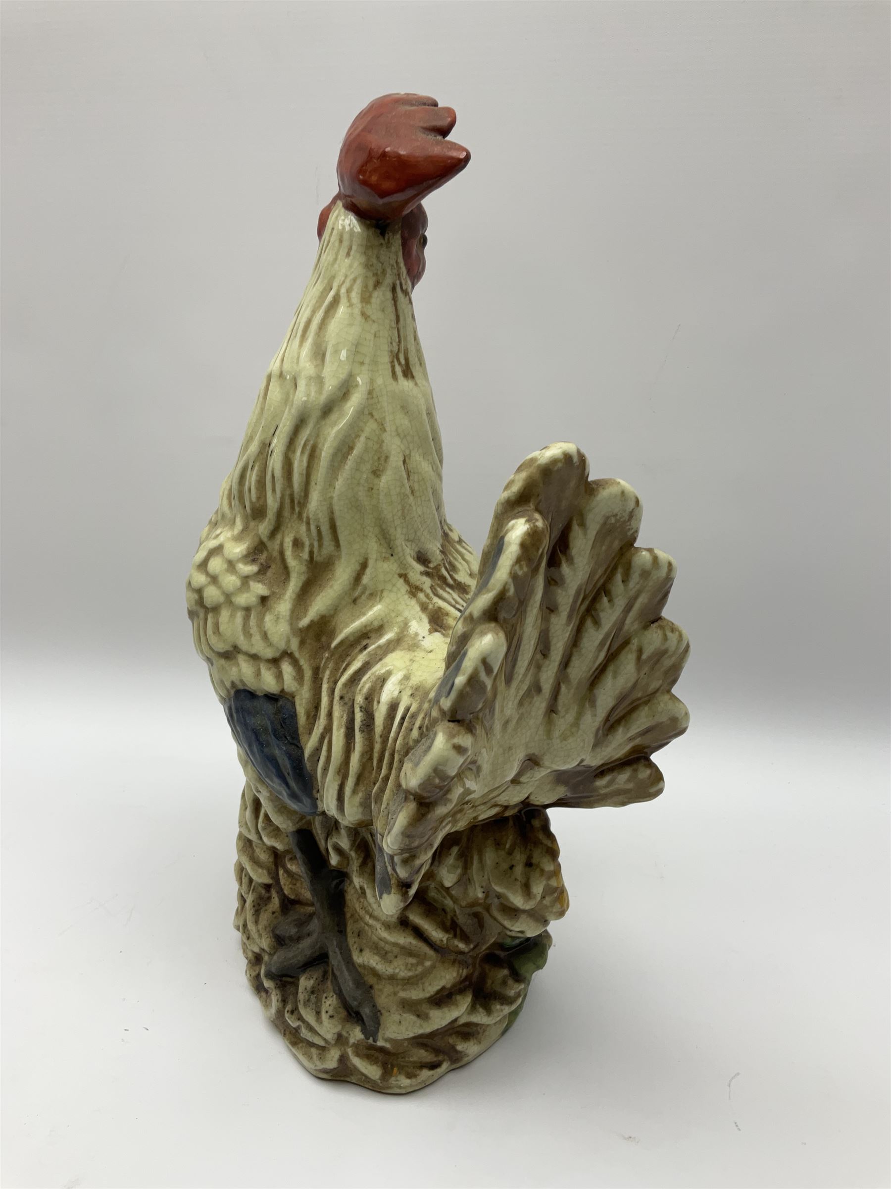 Large ceramic cockerel with sunflowers around the base, H40cm.  