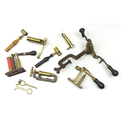 Ten predominantly 19th century brass cartridge making tools comprising Jeffries re-loader, James Dixon Horsley patent redecapper, Webley 7033 screw cap ejector and recapper, Webley double barrel redecapper, all 12-bore, 410 redecapper, pinfire redecapper, two powder/shot measures with turned wooden handles and 16-bore and 18-bore extractors (10)