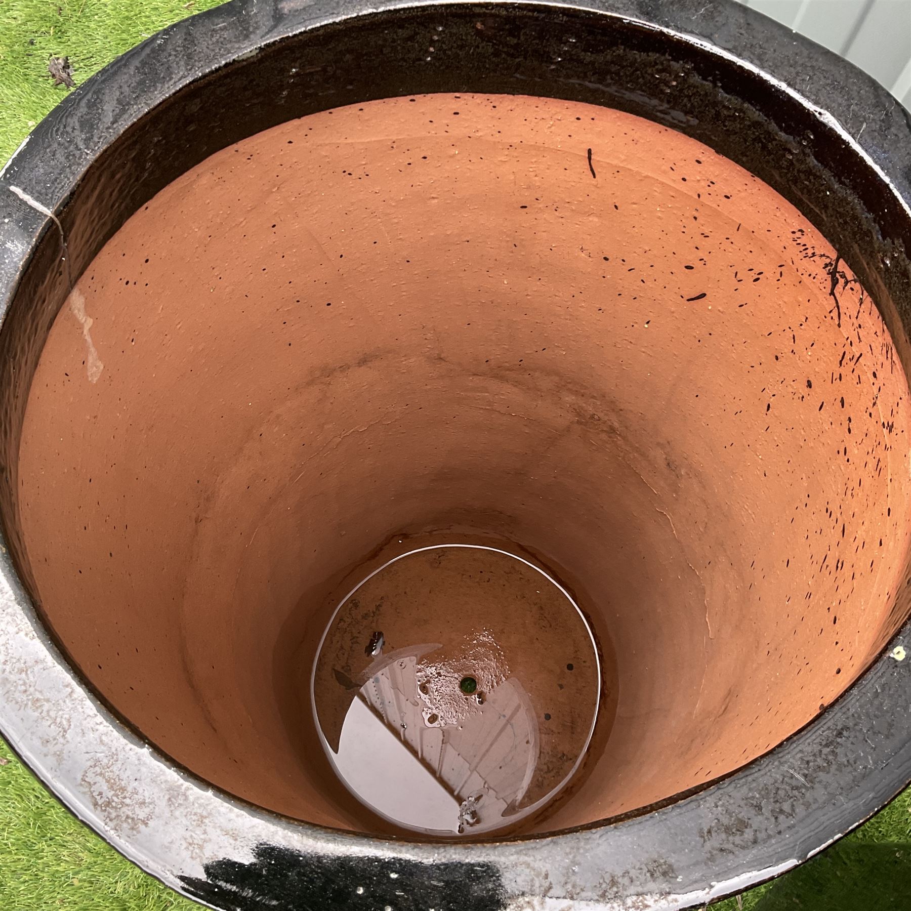 Large rectangular and circular terracotta glazed in black planters - THIS LOT IS TO BE COLLECTED BY APPOINTMENT FROM DUGGLEBY STORAGE, GREAT HILL, EASTFIELD, SCARBOROUGH, YO11 3TX
