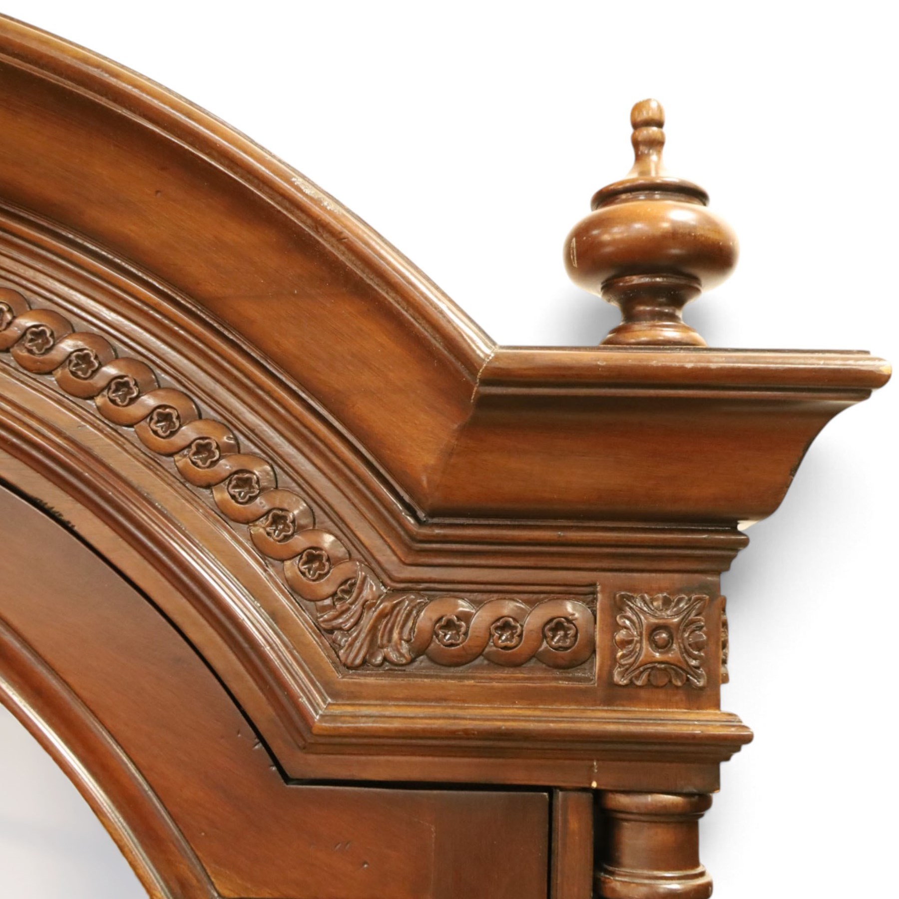 And So To Bed - French design ‘Eclectic’ double wardrobe in dark finish, arched moulded cornice with carved foliate band and turned finials, two mirrored doors enclosing a hanging rail, flanked by turned columns with foliate decoration, single fluted drawer below, on turned tapering feet