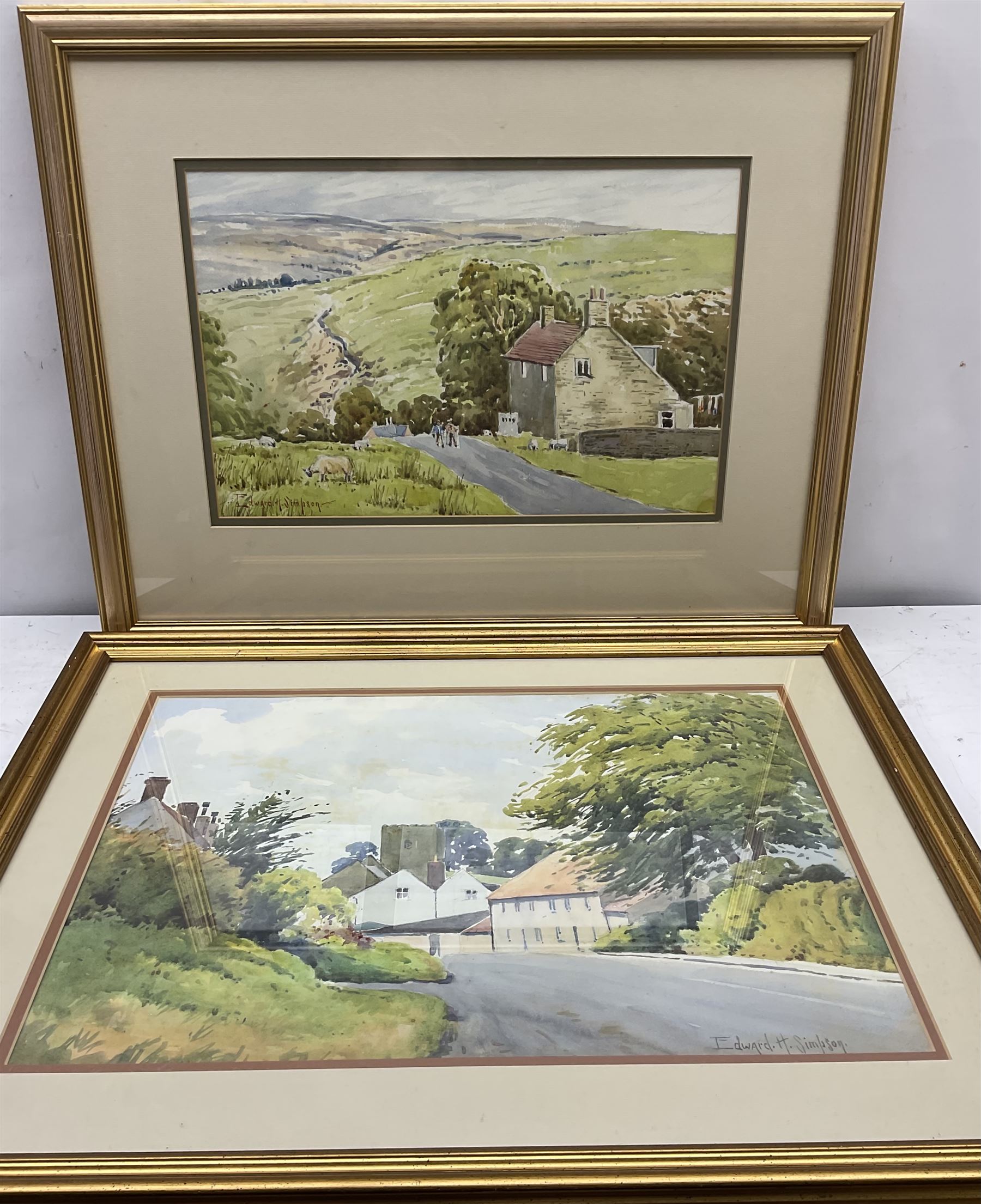 Edward H Simpson (British 1901-1989): Folkton Village Main Street and Hiking through the North Yorkshire Moors, two watercolours signed max 36cm x 52cm (2)