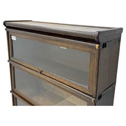 Globe Wernicke - stacking sectional library bookcase, over four glazed up-and-over doors, each bearing original makers mark, on moulded plinth base with inbuilt drawer