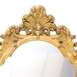 19th century Italian Baroque Revival carved giltwood and gesso wall mirror, the large acanthus leaf pediment flanked by C-scrolls and further acanthi motifs, enclosing a shaped arch plate with moulded slip, flanked by down-scrolls of acanthi with emerging flowering branches, on a stepped base