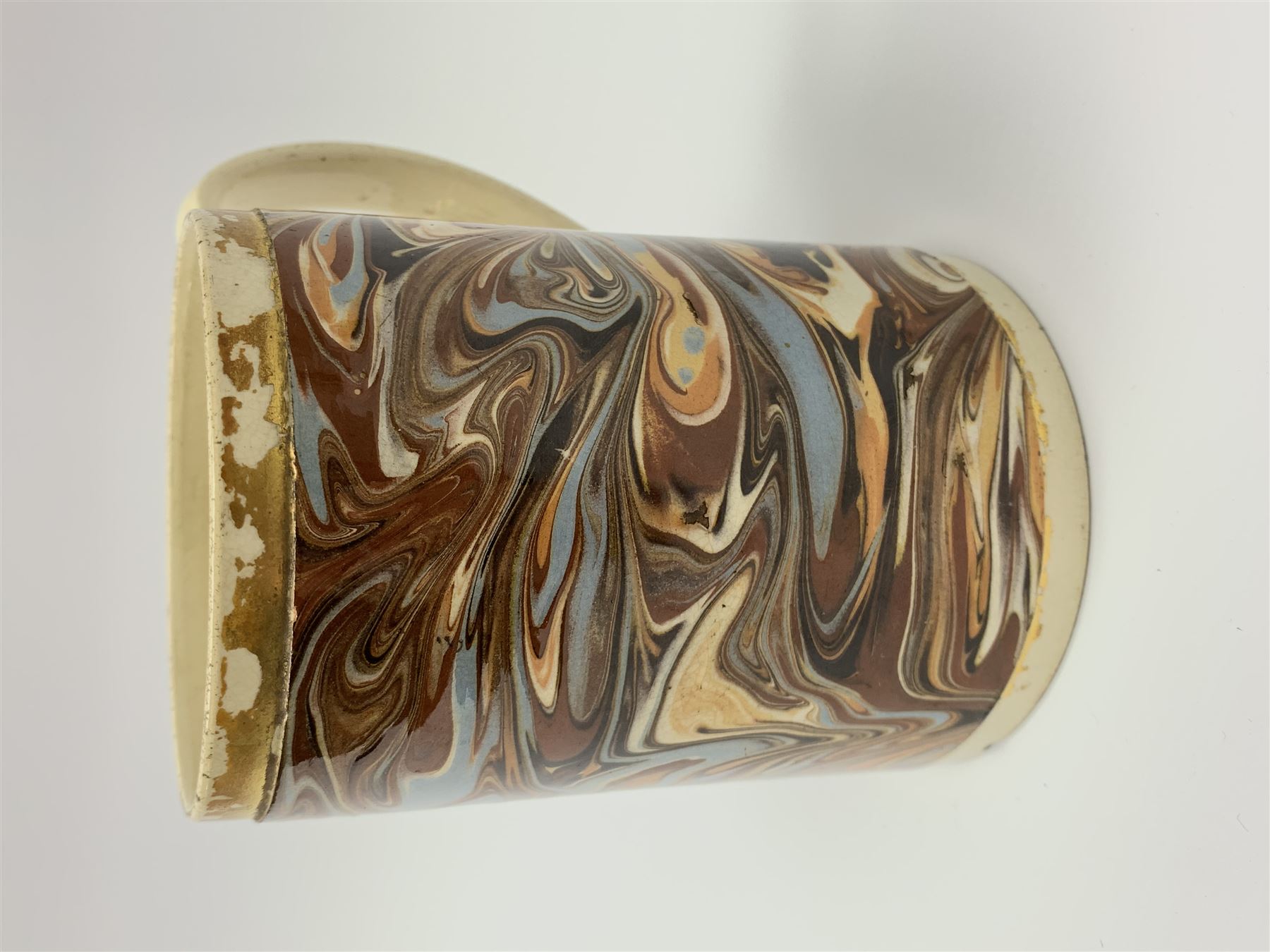 Late 18th century earthenware mug, possibly Ralph Wedgwood, Burslem or Ferrybridge, with surface marbled decoration and later gilt detail to rims and handle, impressed beneath Wedgwood & Co, H12cm