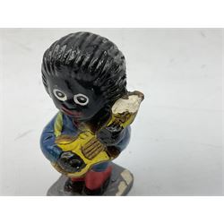 Robinson Jam plaster Golly band, including drummer and singer, H7.5cm

Originally handmade by mothers in Africa for their children from old fabric and cloth, the golly doll was adopted as the mascot and trademark for the Robertson's confectionery brand around 1910 after the company's founder John Robertson visited the US and noticed children playing with them. Robertson's Gollies have been collected by people across the UK and around the world for generations but garnered a contentious image in the 1980s because of links to racism. The trademark was removed from Robertson's branding in 2001.