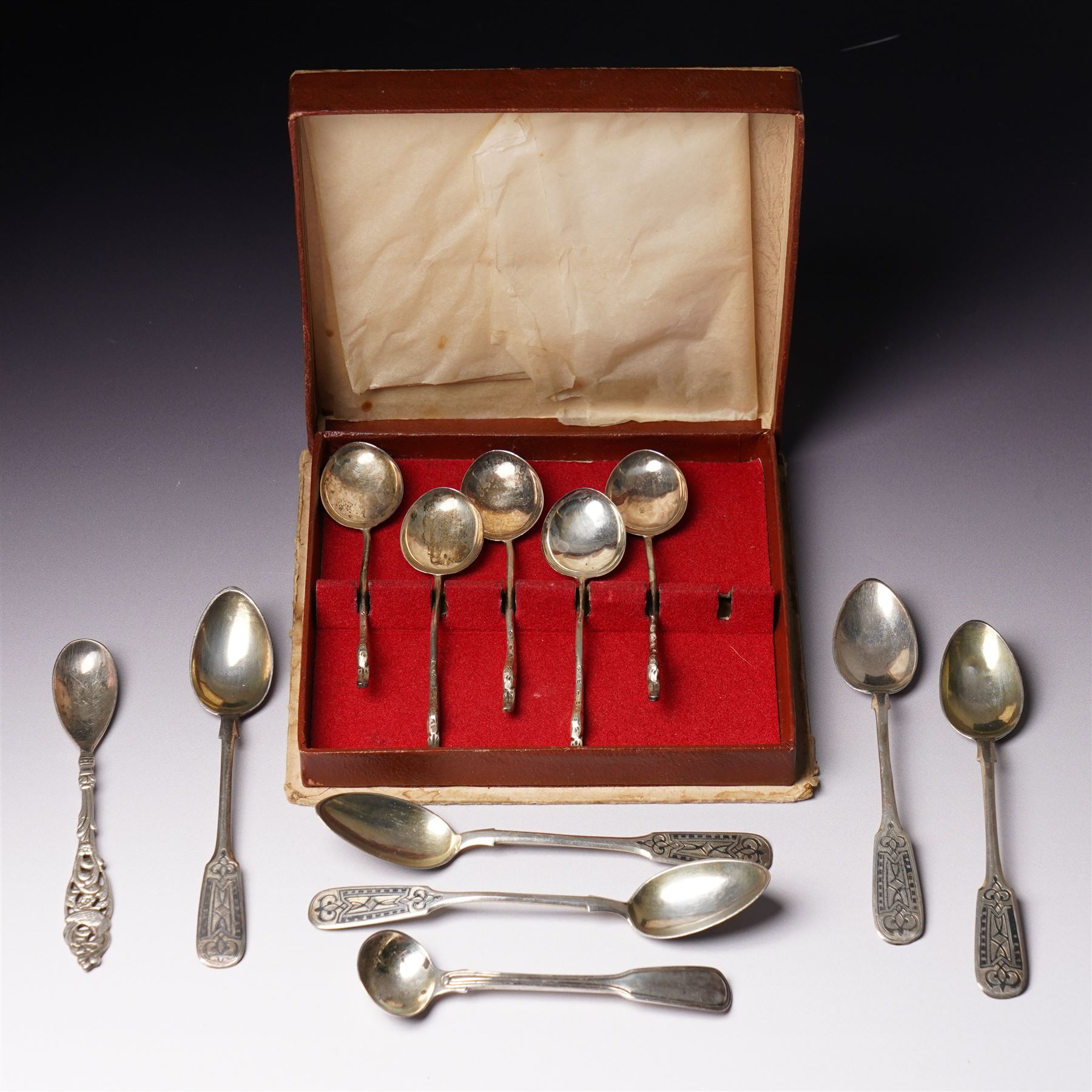 Five Russian 84 standard silver teaspoons with niello work stems and bowls marked 1876, five silver coffee spoons with swans head handles Birmingham 1910, Dutch Gero 90 standard preserve spoon and an early 19th century silver mustard spoon