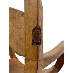 'Gnomeman' oak curved x-framed throne chair, sloped arched cresting rail carved with arcade, studded slung leather seat, the supports joined by sledge feet, rear upright carved with gnome signature, by Thomas Whittaker of Littlebeck