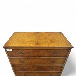 Georgian style walnut chest on stand, the figured top section fitted with four long drawers above a further drawer on the base, brass swan-neck handles, on turned legs joined by shaped stretchers with bun feet